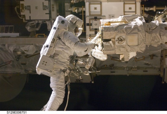 
	Astronaut Robert L. Satcher Jr., STS-129 mission specialist, participates in the mission's first session of extravehicular activity (EVA) as construction and maintenance continue on the International Space Station. During the six-hour, 37-minute spacewalk, Satcher and astronaut Mike Foreman (out of frame), mission specialist, installed a spare S-band antenna structural assembly to the Z1 segment of the station's truss, or backbone. Foreman and Satcher also installed a set of cables for a future space-to-ground antenna on the Destiny laboratory and replaced a handrail on the Unity node with a new bracket used to route an ammonia cable that will be needed for the Tranquility node when it is delivered next year. The two spacewalkers also repositioned a cable connector on Unity, checked S0 truss cable connections, and lubricated latching snares on the Kibo robotic arm and the station's mobile base system.
	
	Date: 19 November 2009
	
	Source: NASA