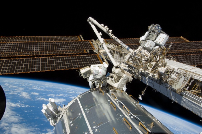 
	Backdropped against the horizon of Earth, astronauts Mike Foreman (center frame) and Randy Bresnik, STS-129 mission specialists, perform a series of tasks on the exterior of the International Space Station during the second space walk of Atlantis' visit to the orbital outpost.
	Date: 21 November 2009
	
	Source: http://spaceflight.nasa.gov/gallery/images/shuttle/sts-129/html/s129e007278.html