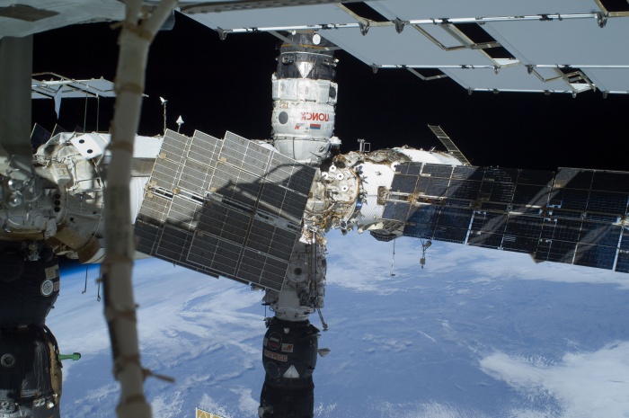 
	The Russian segment of the International Space Station is featured in this image photographed by a space-walking astronaut during the third and final spacewalk for the STS-129 mission. The Poisk Mini Research Module 2 (MRM2), docked to the space-facing port of the Zvezda Service Module, is at top center; and a Progress resupply vehicle is docked to the Pirs Docking Compartment at bottom center. Zarya (partially obscured by solar panels) is at right center. Earth's horizon and the blackness of space provide the backdrop for the scene.
	Date: 23 November 2009(2009-11-23)
	
	Source: http://spaceflight.nasa.gov/gallery/images/shuttle/sts-129/html/iss021e031841.html