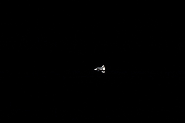 
	Space Shuttle Atlantis (STS-129) as seen fom the International Space Station (Expedition 21). backdropped By the Blackness of Space, November 18, 2009
	
	Credit: NASA
