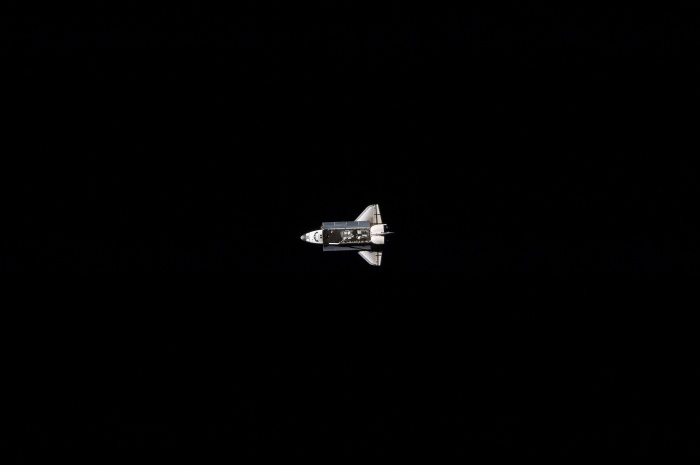 
	Space Shuttle Atlantis (STS-129), against the blackness of space, approaches closer To the International Space Station, November 18, 2009
	As seen from the International Space Station (Expedition 21)
	
	Credit: NASA