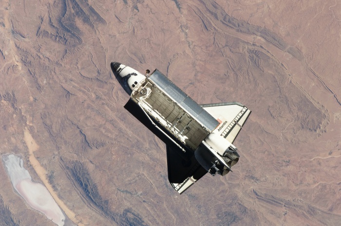 
	Space shuttle Atlantis (STS-129) high above rugged terrain In North Africa while peforming a flyaround of the International Space Station
	November 25, 2009
	
	Credit: NASA