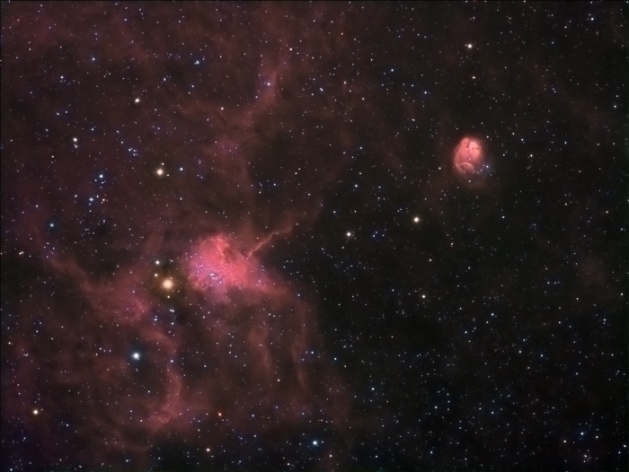 
	The Spider and The Fly
	Credit & Copyright: Troy Tsounis
	Astronomy Picture of the Day - 2010 January 13
	
	Explanation: Bright clusters and nebulae abound in the ancient northern constellation of Auriga. The region includes the open star cluster M38, emission nebula IC 410 with Tadpoles, Auriga's own Flaming Star Nebula IC 405, and this interesting pair IC 417 (lower left) and NGC 1931. An imaginative eye toward the expansive IC 417 and diminutive NGC 1931 suggests a cosmic spider and fly. About 10,000 light-years distant, both represent young, open star clusters formed in interstellar clouds and still embedded in glowing hydrogen gas. For scale, the more compact NGC 1931 is about 10 light-years across.