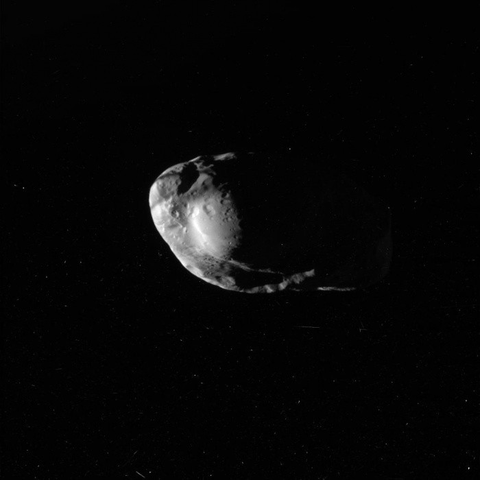 
	Shepherd Moon Prometheus from Cassini
	Credit: Cassini Imaging Team, SSI, JPL, ESA, NASA
	Astronomy Picture of the Day - 2010 February 1
	
	Explanation: Another moon of Saturn has been imaged in detail by the Cassini spacecraft. Orbiting Saturn since 2004, the robotic Cassini got its closest look yet at Saturn's small moon Prometheus last week. Visible above in an unprocessed image from 36,000 kilometers away, Prometheus' 100-km long surface was revealed to have an interesting system of bulges, ridges, and craters. These features, together with the moon's oblong shape and high reflectivity, are now being studied to help better understand the history of Prometheus and Saturn's rings. Prometheus is one of the few shepherd satellites known, as its gravity, along with its companion moon Pandora, confines many smaller ice chucks into Saturn's F Ring. Cassini's next major targeted flyby is of the moon Rhea on March 2.