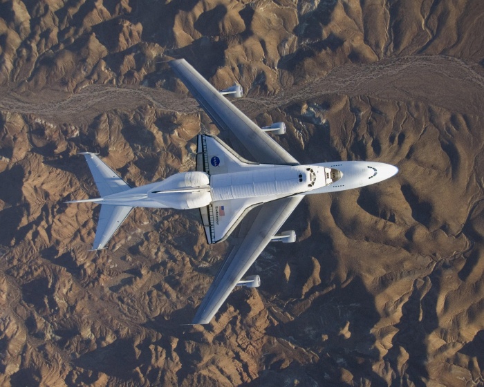 
	The space shuttle Endeavour, fresh from the STS-126 mission and mounted atop its modified Boeing 747 carrier aircraft, flies over California's Mojave Desert on a three-day trip back to the Kennedy Space Center in Florida on Wednesday Dec. 10, 2008. NASA officials said Wednesday Dec. 17, 2008 that it is looking for ideas on where and how best to display its space shuttles once they stop flying in a few years. Beware: NASA estimates it will cost about $42 million to get each shuttle ready and get it where it needs to go, and the final tab could end up much more. The estimate includes $6 million to ferry the spaceship atop a modified jumbo jet to the closest major airport. (AP Photo/NASA)