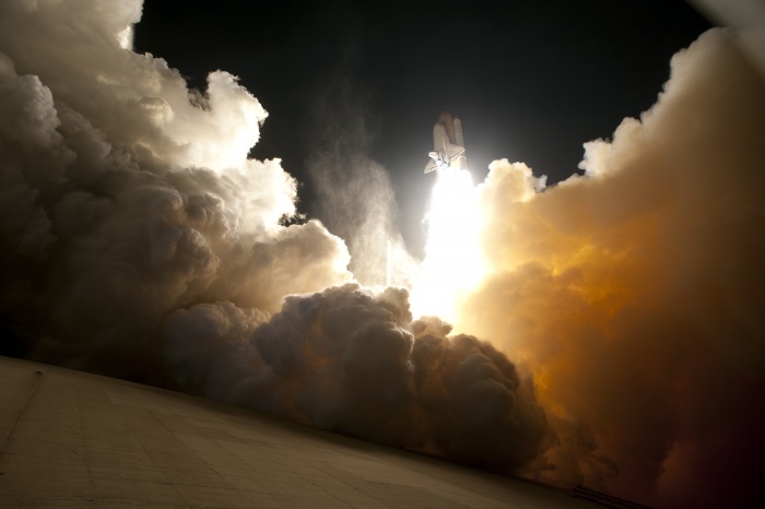 
	Night Launch of the Space Shuttle Endeavour
	Credit: NASA
	Astronomy Picture of the Day - 2010 February 9
	
	Explanation: Sometimes, the space shuttle launches at night. Pictured above, the space shuttle Endeavour lifted off in yesterday's early morning hours from Launch Pad 39A in Kennedy Space Center, Florida, USA, bound for the International Space Station (ISS). A night launch, useful for reaching the space station easily during some times of the year, frequently creates vivid launch imagery. The shuttle, as pictured above, is framed by an enormous but typical exhaust plume ejected as the shuttle's powerful rockets began lifting the two million kilogram space bus into Earth orbit. Endeavour's mission, labeled STS-130, includes the delivery of the Tranquility module to the space station. Tranquility will provide extra room for space station astronauts and includes a large circular set of windows designed to bestow vastly improved views of the Earth, the night sky, and the space station itself.