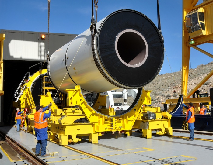 
	September 2010 - Technicians at ATK Space System's test stand in Promontory, Utah, gently guided a segment of NASA's five-segment development motor, or DM-2, into place in preparation for the second full-duration ground test, also called a 