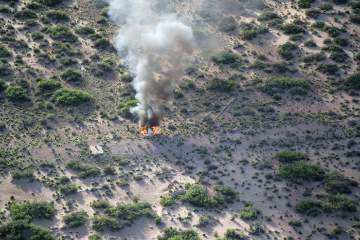 
	6 May 2010 --- Only the adapter cone among the components of the Launch Abort System is visible in this post-test scene at White Sands Missile Range. The launch complex can be seen in the background. Photo credit: U.S. Army’s White Sands Missile Range