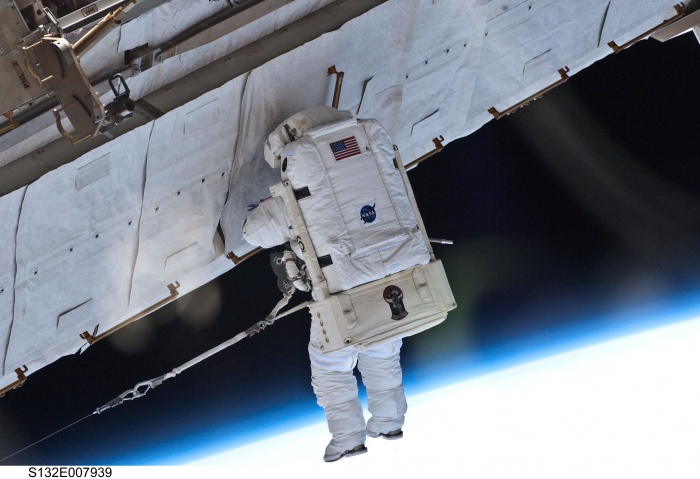
	S132-E-007939 (17 May 2010) --- NASA astronaut Garrett Reisman, STS-132 mission specialist, participates in the mission's first session of extravehicular activity (EVA) as construction and maintenance continue on the International Space Station. During the seven-hour, 25-minute spacewalk, Reisman and NASA astronaut Steve Bowen (out of frame), mission specialist, loosened bolts holding six replacement batteries, installed a second antenna for high-speed Ku-band transmissions and adding a spare parts platform to Dextre, a two-armed extension for the station's robotic arm.