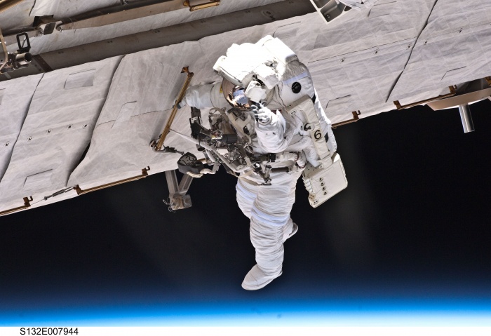 
	S132-E-007944 (17 May 2010) --- NASA astronaut Garrett Reisman, STS-132 mission specialist, participates in the mission's first session of extravehicular activity (EVA) as construction and maintenance continue on the International Space Station. During the seven-hour, 25-minute spacewalk, Reisman and NASA astronaut Steve Bowen (out of frame), mission specialist, loosened bolts holding six replacement batteries, installed a second antenna for high-speed Ku-band transmissions and adding a spare parts platform to Dextre, a two-armed extension for the station's robotic arm.