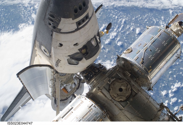 
	ISS023-E-044747 (17 May 2010) --- This image features the space shuttle Atlantis's cabin and forward cargo bay and part of the International Space Station while the two spacecraft remain docked, during STS-132's flight day four extravehicular activity of astronauts Garrett Reisman and Steve Bowen (both out of frame). Though three sessions of extravehicular activity (EVA) will involve only three astronauts (two on each occasion) who actually leave the shirt-sleeve environments of the two docked spacecraft, all twelve astronauts and cosmonauts on the two combined crews have roles in supporting the EVA work. Photo credit: NASA or National Aeronautics and Space Administration
