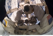 Garrett Reisman, STS-132 mission specialist, takes a busy 