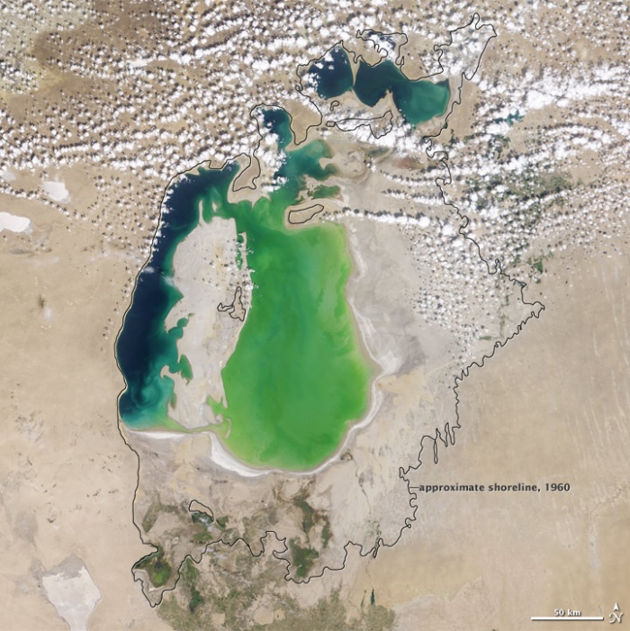 In the 1960s, the Soviet Union undertook a major water diversion project on the arid plains of Kazakhstan, Uzbekistan, and Turkmenistan. The region’s two major rivers, fed from snowmelt and precipitation in far-away mountains, were used to transform the desert into fields for cotton and other crops. Before the project, the two rivers left the mountains, cut northwest through the Kyzylkum Desert—the Syrdar’ya to the north and the Amudar’ya in parallel to the south—and finally pooled together in the lowest part of the desert basin. The lake they made, the Aral Sea, was once the fourth largest lake in the world. Photo NASA