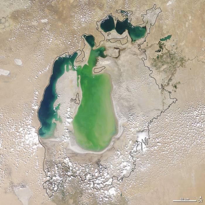 Aral sea in 2001 as seen by images from the Moderate Resolution Imaging Spectroradiometer (MODIS) on NASA’s Terra satellite. Although irrigation made the desert bloom, it devastated the Aral Sea. This series of images from the Moderate Resolution Imaging Spectroradiometer (MODIS) on NASA’s Terra satellite documents the changes in the the Aral Sea throughout the past decade. At the start of the series in 2000, the lake was already a fraction of its 1960 extent (black line). The Northern Aral Sea (sometimes called the Small Aral Sea) had separated from the Southern (Large) Aral Sea. The Southern Aral Sea had split into an eastern and a western lobe that remained tenuously connected at both ends. Photo and words: NASA