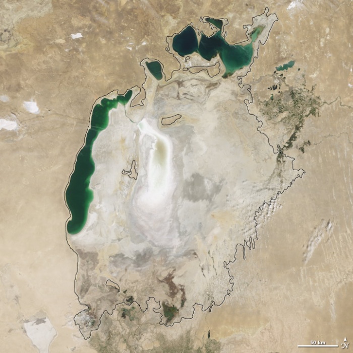 Aral sea in 2009 as seen by images from the Moderate Resolution Imaging Spectroradiometer (MODIS) on NASA’s Terra satellite. The final image in the series is from the summer of 2009. Blowing dust (salt-laden sediments) covers a large part of the sea. In a last-ditch effort to save some of the lake, Kazakhstan built a dam between the northern and southern parts of the Aral Sea. Completed in 2005, the dam was basically a death sentence for the southern Aral Sea, which was judged to be beyond saving. All of the water flowing into the desert basin from the Syrdar’ya now stays in the Northern Aral Sea. Between 2005 and 2006, the water levels in that part of the lake rebounded significantly and very small increases are visible throughout the rest of the time period. The differences in water color are due to changes in sediment. Photo and words: NASA