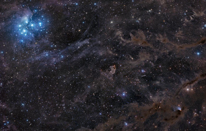    Sisters of the Dusty Sky  Credit:   John Davis Astronomy Picture of the Day - 2010 November 18  Explanation: Hurtling through a cosmic dust cloud some 400 light-years away, the lovely Pleiades or Seven Sisters star cluster is well-known for its striking blue reflection nebulae. In the dusty sky toward the constellation Taurus and the Orion Arm of our Milky Way Galaxy, this remarkable image shows the famous star cluster at the upper left. But lesser known dusty nebulae lie along the region's fertile molecular cloud, within the 10 degree wide field, including the bird-like visage of LBN 777 near center. Small bluish reflection nebula VdB 27 at the lower right is associated with the young, variable star RY Tau. At the distance of the Pleiades, the 5 panel mosaic spans nearly 70 light-years.