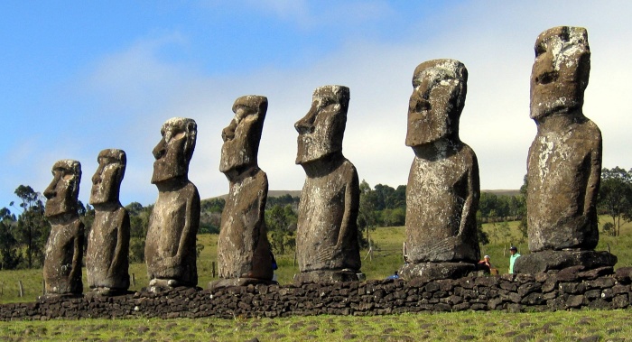 
	Its stone giants on average stand 13 feet high and weigh 14 tons, large heads on male torsos fashioned after the penis, carved from volcanic ash, called moai. They stand on sacred pedestals called ahu. Do not walk on these platforms. Most all of the moai are erected around the coast and face inland towards their villages with their backs to the sea. 
	Source: http://www.highonadventure.com/Hoa06dec/Steve/Easter.htm