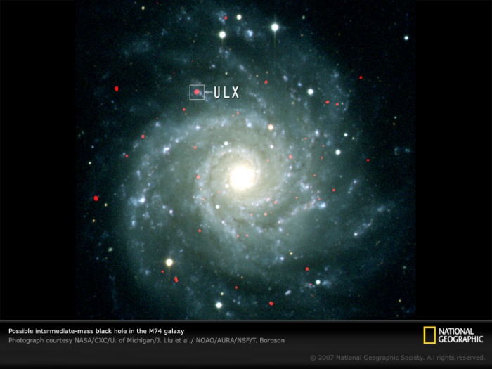 
	Astronomers think the object shown in this Chandra X-ray Observatory image (in box) may be an elusive intermediate-mass black hole. Located about 32 million light-years from Earth in the Messier 74 galaxy (M74), this object emits periodic bursts of x-rays at a rate that suggests it is much larger than a stellar-mass black hole but significantly smaller than the supermassive black holes found at the centers of galaxies. Few such middling black holes have been discovered, and scientists aren't sure how they form.
	Photograph courtesy NASA/CXC/U. of Michigan/J. Liu et al./ NOAO/AURA/NSF/T. Boroson