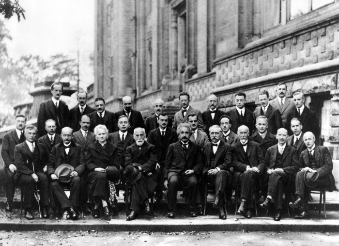 
	1927 Fifth Solvay Conference on Physics
	

	Fifth conference participants, 1927. Institut International de Physique Solvay in Leopold Park.
	Photograph by Benjamin Couprie, Institut International de Physique Solvay, Brussels, Belgium

	Auguste Piccard, Émile Henriot, Paul Ehrenfest, Édouard Herzen, Théophile de Donder, Erwin Schrödinger, Jules-Émile Verschaffelt, Wolfgang Pauli, Werner Heisenberg, Ralph Howard Fowler, Léon Brillouin, Peter Debye, Martin Knudsen, William Lawrence Bragg, Hendrik Anthony Kramers, Paul Dirac, Arthur Compton, Louis de Broglie, Max Born, Niels Bohr, Irving Langmuir, Max Planck, Marie Curie, Hendrik Lorentz, Albert Einstein, Paul Langevin, Charles Eugène Guye, Charles Thomson Rees Wilson, Owen Willans Richardson

	Perhaps the most famous conference was the October 1927 Fifth Solvay International Conference on Electrons and Photons, where the world's most notable physicists met to discuss the newly formulated quantum theory. The leading figures were Albert Einstein and Niels Bohr. Einstein, disenchanted with Heisenberg's 