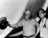 Homestake Mine: Ray Davis and John Bahcall pose by the tank