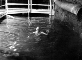 Ray Davis swim in the 300,000-gallon tank of water a mile underground in the Homestake mine