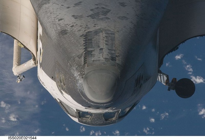 
	July 17, 2009 (Flight Day 3, ISS Docking)

	This view of the underside of the crew cabin of the Space Shuttle Endeavour was provided by an Expedition 20 crewmember during a survey of the approaching vehicle prior to docking with the International Space Station. As part of the survey and part of every mission's activities, the STS 127 Endeavour crew performed a back-flip for the rendezvous pitch maneuver (RPM). The image was photographed with a digital still camera, using a 400mm lens at a distance of about 600 feet (180 meters).
	
	Source: Wikipedia