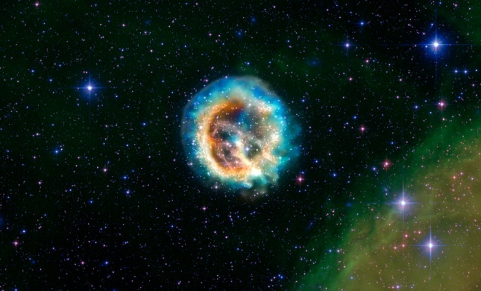 
	* E0102 is the debris of a very massive star that exploded in the neighboring galaxy known as the Small Magellanic Cloud
	
	* Chandra first looked at this object nearly ten years ago, just months after the telescope was launched
	
	* Analysis of new Chandra data gives information on the geometry of the supernova explosion
	
	* The best model based on the data is that the ejecta is shaped like a cylinder that we see end-on
	
	
	This image of the debris of an exploded star - known as supernova remnant 1E 0102.2-7219, or 