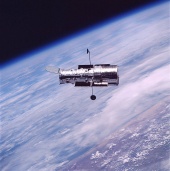 Hubble floating above Earth