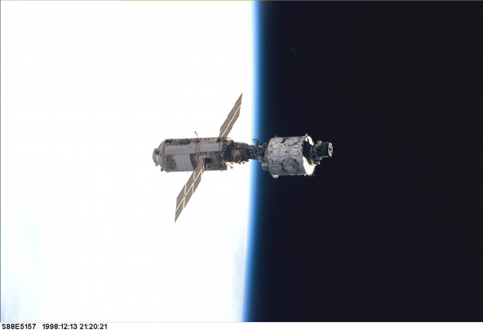 
	STS088-E-5157 (12-13-98) --- The mated Russian-built Zarya (left, if the picture is held horizontally) and U.S.-built Unity modules are backdropped against the blackness of space and Earth's horizon shortly after leaving Endeavour's cargo bay. The photo was taken with an electronic still camera at 21:20:21 GMT, Dec. 13.

	Source: http://spaceflight.nasa.gov/gallery/images/station/assembly/ndxpage1.html