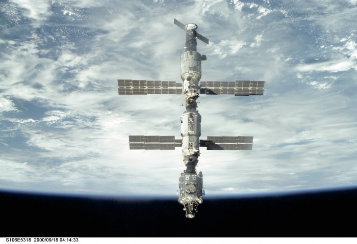 
	S106-E-5318 (18 September 2000) --- Backdropped against Earth's horizon, the International Space Station (ISS) is seen following its undocking with the Space Shuttle Atlantis. After accomplishing all mission objectives in outfitting the station for the first resident crew, the seven astronauts and cosmonauts undocked at 3:46 GMT on Sept. 18 over Russia near the northeastern portion of the Ukraine. When Atlantis was at a safe distance from the station, about 450 feet, astronaut Scott D. Altman, pilot, performed a 90-minute, double-loop fly around to enable the crew to document the station’s exterior. He fired Atlantis’ jets one final time to separate from the station at 5:35 (GMT) September 18.
	
	Source: http://spaceflight.nasa.gov/gallery/images/station/assembly/ndxpage2.html