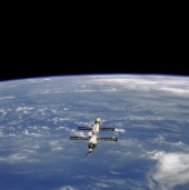 14. ISS: nearest the camera is the Progress supply craft, which joined ISS in August 2000