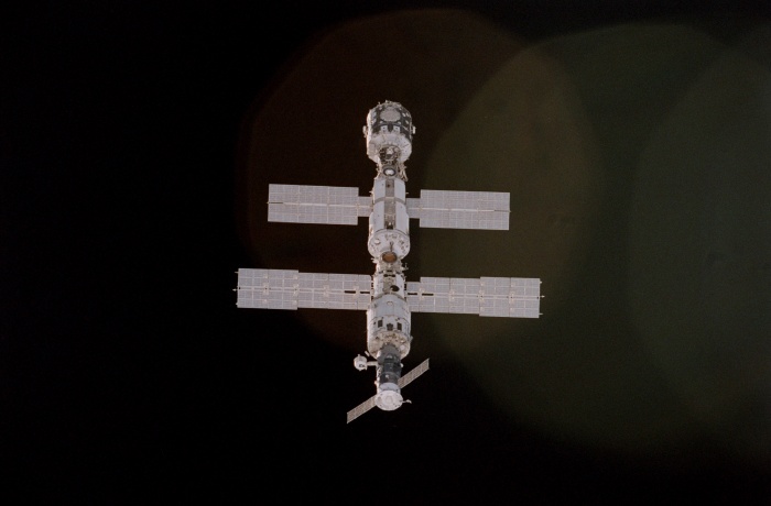 
	STS092-405-013 (11-26 October 2000) --- Not long before the link-up of the Space Shuttle Discovery and the International Space Station (ISS), a crew member onboard the shuttle used a 35mm camera to grab this vertical image of the station. This was one of the last looks at the station in the represented configuration, as the seven-member team went about changing its appearance with the addition of important new pieces. Backdropped against the blackness of space, the various elements visible, from top to bottom, are Node 1 or Unity, the functional cargo block (FGB) or Zarya, the service module or Zvezda, and a Progress cargo supply vehicle.