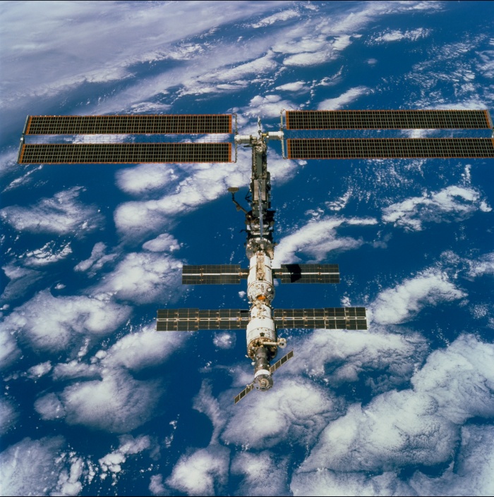 
	STS097-704-071 (9 December 2000) --- This picture is one of a series of 70mm frames exposed of the International Space Station (ISS) following undocking at 1:13 p.m. (CST), December 9, 2000. This series of images, as well as video and digital still imagery taken at the same time, represent the first imagery of the entire station with its new solar array panels deployed. Before separation, the shuttle and space station had been docked to one another for 6 days, 23 hours and 13 minutes. Endeavour moved downward from the space station, then began a tail-first circle at a distance of about 500 feet. The maneuver, with pilot Michael J. Bloomfield at the controls, took about an hour. While Endeavour flew that circle, the two spacecraft, moving at five miles a second, navigated about two-thirds of the way around the Earth. Undocking took place 235 statute miles above the border of Kazakhstan and China. When Endeavour made its final separation burn, the orbiter and the space station were near the northeastern coast of South America.
	
	Source: http://spaceflight.nasa.gov/gallery/images/station/assembly/ndxpage3.html