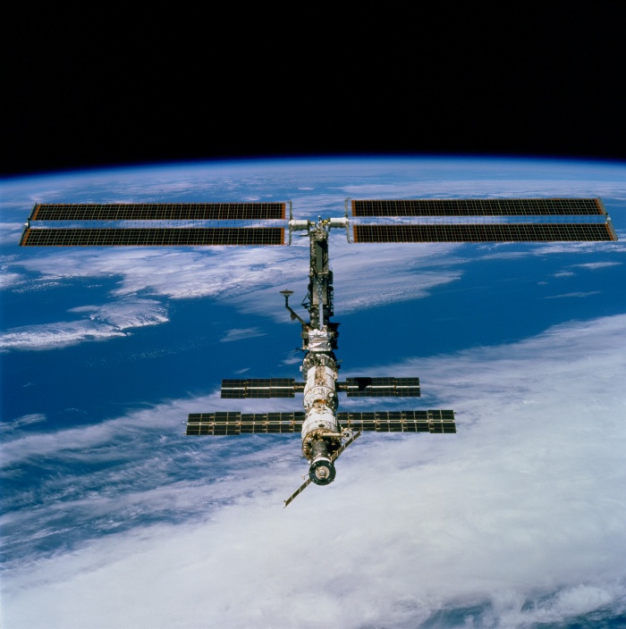 
	STS097-704-080 (9 December 2000) --- This picture is one of a series of 70mm frames exposed of the International Space Station (ISS) following undocking at 1:13 p.m. (CST), December 9, 2000. This series of images, as well as video and digital still imagery taken at the same time, represent the first imagery of the entire station with its new solar array panels deployed. Before separation, the shuttle and space station had been docked to one another for 6 days, 23 hours and 13 minutes. Endeavour moved downward from the space station, then began a tail-first circle at a distance of about 500 feet. The maneuver, with pilot Michael J. Bloomfield at the controls, took about an hour. While Endeavour flew that circle, the two spacecraft, moving at five miles a second, navigated about two-thirds of the way around the Earth. Undocking took place 235 statute miles above the border of Kazakhstan and China. When Endeavour made its final separation burn, the orbiter and the space station were near the northeastern coast of South America.
	
	Source: http://spaceflight.nasa.gov/gallery/images/station/assembly/ndxpage3.html