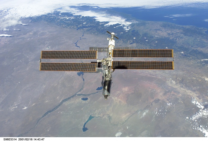 
	STS98-E-5314 (16 February 2001) --- The International Space Station (ISS) backdropped against the Rio Negro, Argentina, following undocking. The photo was taken with a digital still camera.
	
	Source: http://spaceflight.nasa.gov/gallery/images/station/assembly/ndxpage3.html