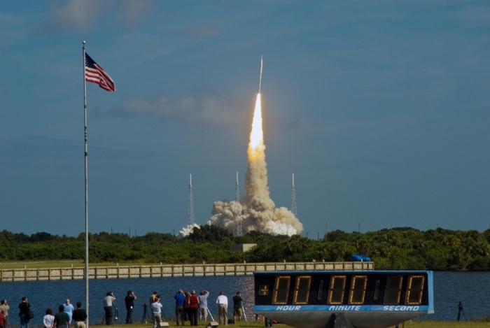 
	Ares I-X Launches!
	
	The stars and stripes on the American flag reflect NASA's commitment to teamwork as the Constellation Program's Ares I-X test rocket roars off Launch Complex 39B at NASA's Kennedy Space Center in Florida.
	
	The rocket produces 2.96 million pounds of thrust at liftoff and reaches a speed of 100 mph in eight seconds. Liftoff of the 6-minute flight test was at 11:30 a.m. EDT.