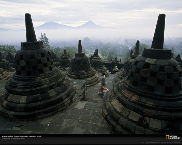 
	Borobudur Temple, Java, Indonesia, 2001
	by National Geographic

	A woman walks among the bell-shaped spires of Indonesia's Borobudur—the world's largest Buddhist temple. Built in the jungles of Java during the eighth and ninth centuries A.D., this ancient pilgrimage site lay abandoned for centuries until it was rediscovered and restored in the early 1900s.
	
	(Photo shot on assignment for, but not published in, 